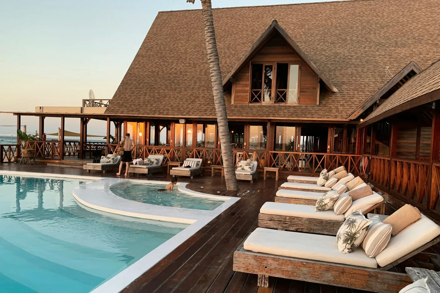 A real hotel pool and guest building prepared for travelers