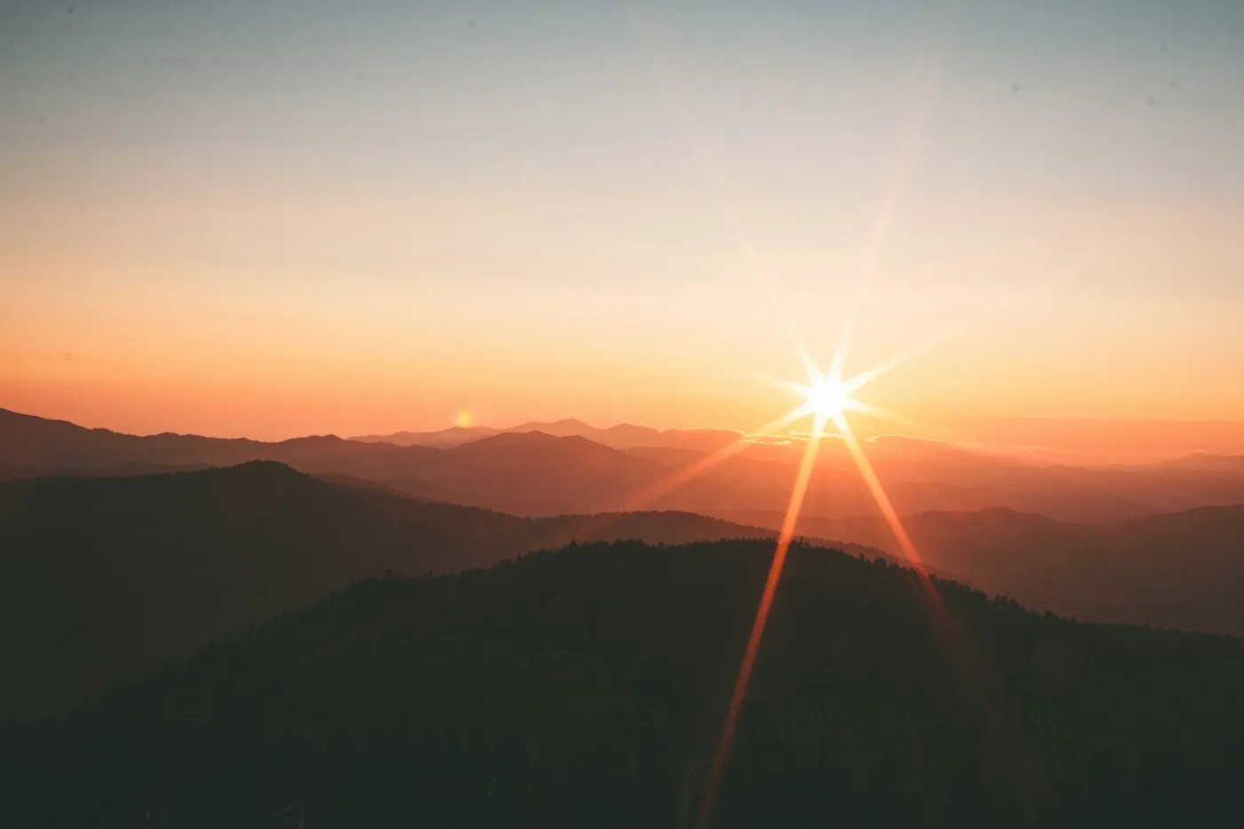 Mountain ridges at sunset for a solo travel guide