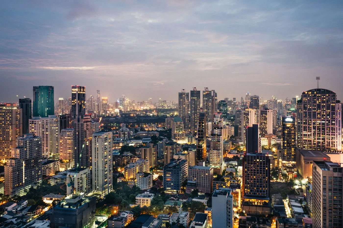 A real city skyline glowing at dusk in southern China